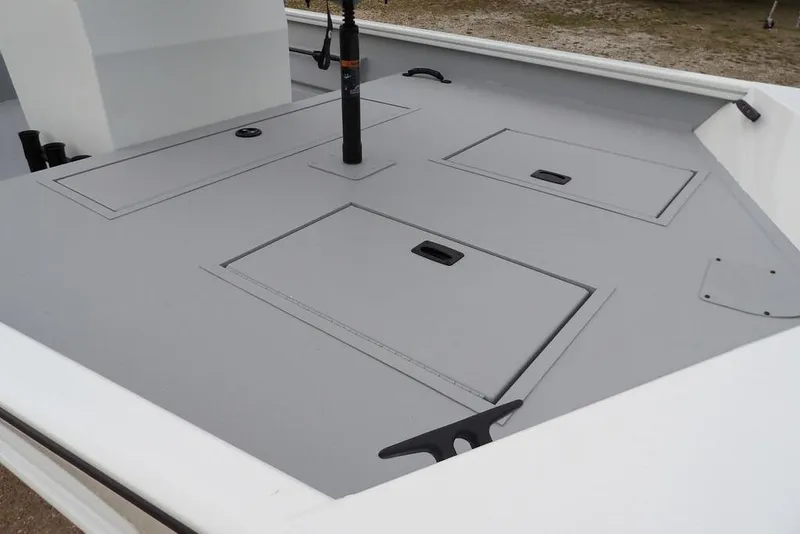 Slide: The Image of 2026 Crestliner 1870 Retriever FCC boat deck with storage compartments. - 10