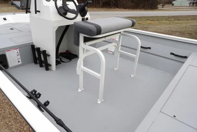 Slide: The Image of 2026 Crestliner 1870 Retriever FCC boat interior with steering console and seating. - 13