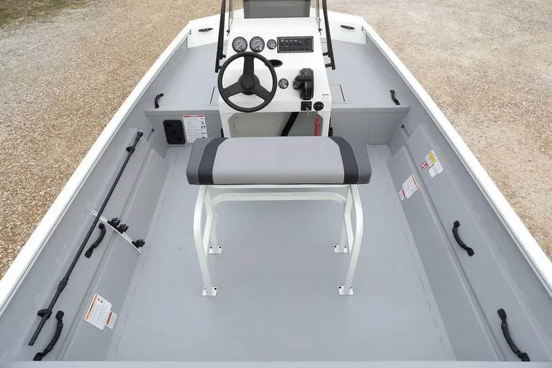 Slide: The Image of 2026 Crestliner 1870 Retriever FCC boat interior with steering console and seating. - 15