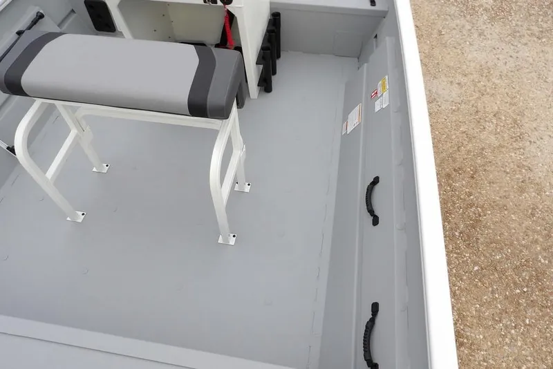 Slide: The Image of 2026 Crestliner 1870 Retriever FCC interior with bench seat and storage handles. - 17