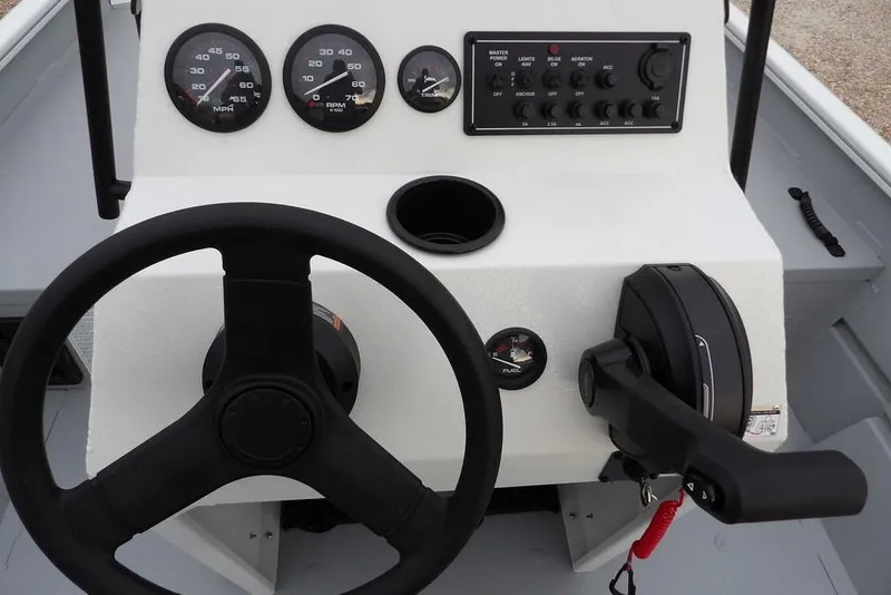 Slide: The Image of 2026 Crestliner 1870 Retriever FCC boat dashboard with steering wheel and control panel. - 19