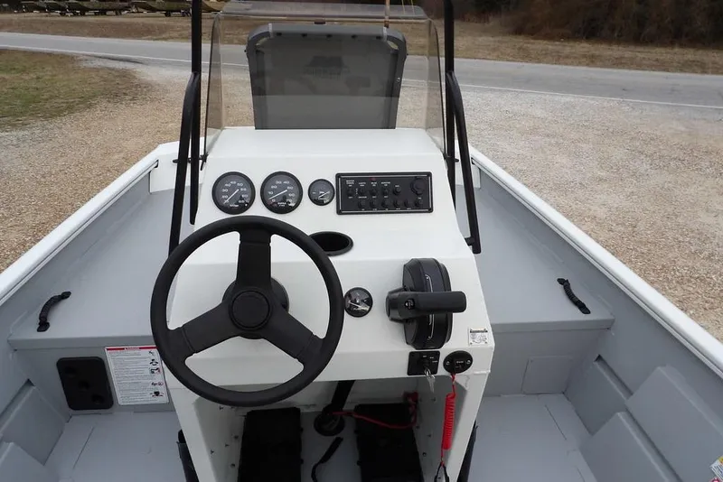 Slide: The Image of 2026 Crestliner 1870 Retriever FCC boat dashboard with steering wheel and control panel. - 22