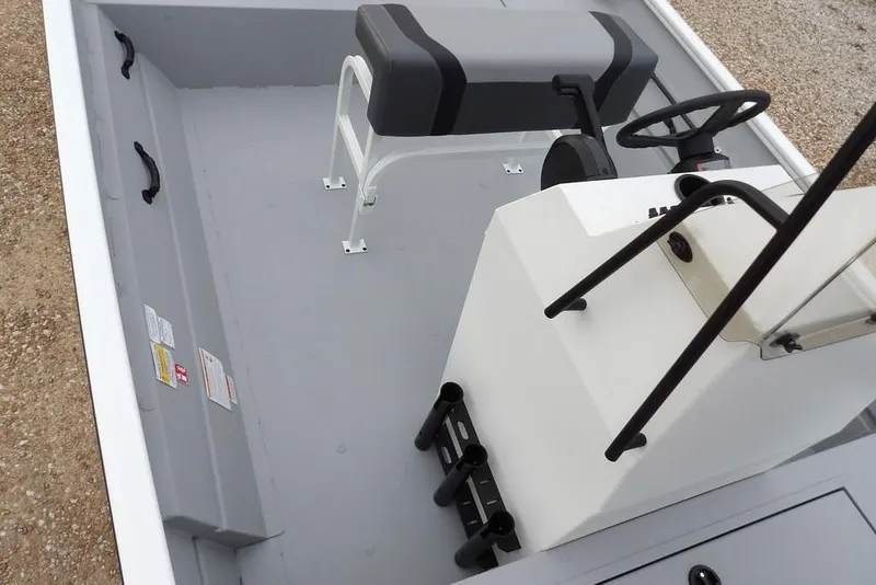 Slide: The Image of 2026 Crestliner 1870 Retriever FCC boat interior with steering console and seating. - 23