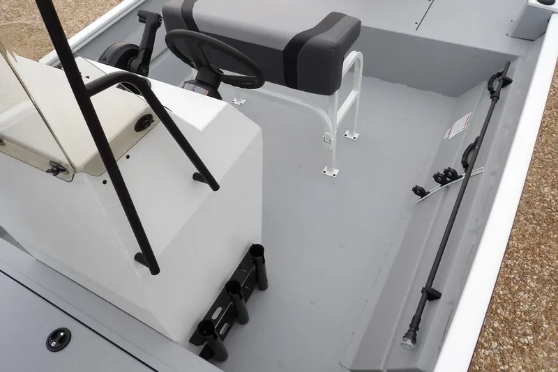 Slide: The Image of 2026 Crestliner 1870 Retriever FCC boat interior with steering console and seating. - 24