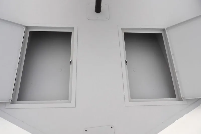 Slide: The Image of Storage compartments on 2026 Crestliner 1870 Retriever FCC boat, open and empty. - 29