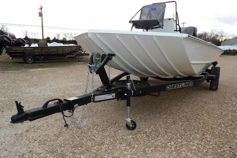 Slide: The Image of 2026 Crestliner 1870 Retriever FCC boat on trailer, parked on gravel. - 34