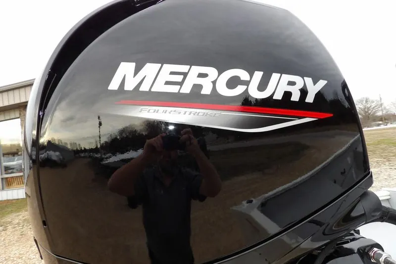 Slide: The Image of Mercury FourStroke engine on 2026 Crestliner 1870 Retriever FCC boat, reflecting surroundings. - 37