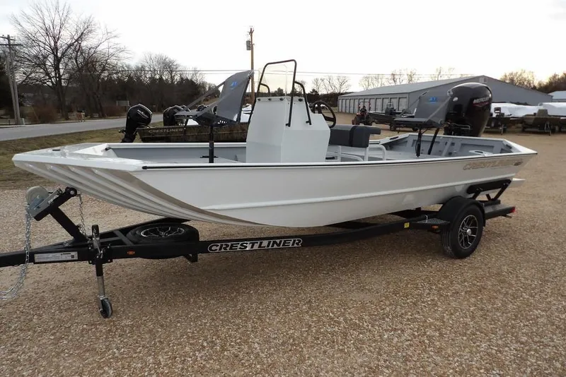 Slide: The Image of 2026 Crestliner 1870 Retriever FCC boat on trailer, parked outdoors. - 7