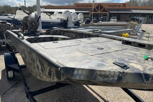 Slide: The Image of 2026 Excel Eclipse 1554 boat with camouflage design at a marine dealership. - 3