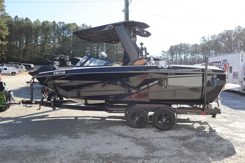 The Image of 2023 Nautique Super Air Nautique G23 boat on trailer, parked outdoors. - 0