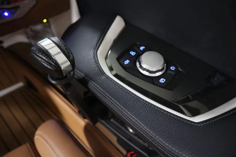 Slide: The Image of 2023 Nautique Super Air Nautique G23 control panel with sleek design and illuminated buttons. - 11