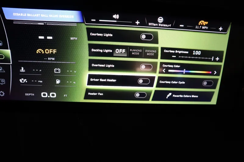 Slide: The Image of 2023 Nautique Super Air Nautique G23 dashboard display with lighting and control settings. - 13