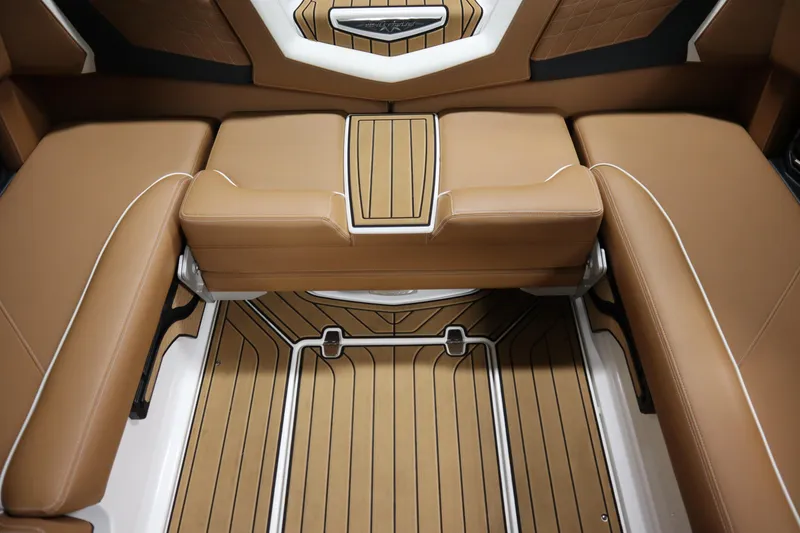 Slide: The Image of Luxurious interior of 2023 Nautique Super Air Nautique G23 boat with tan seating. - 24