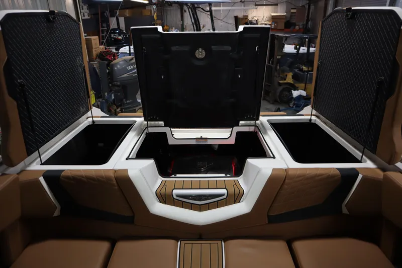Slide: The Image of 2023 Nautique Super Air Nautique G23 interior storage compartments open. - 28