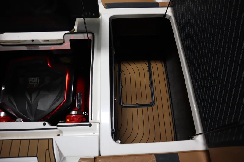 Slide: The Image of 2023 Nautique Super Air Nautique G23 engine compartment and storage area. - 29