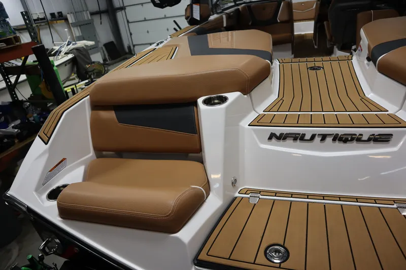 Slide: The Image of 2023 Nautique Super Air Nautique G23 boat interior with tan seating and teak-style flooring. - 36