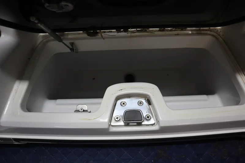 Slide: The Image of 2023 Nautique Super Air Nautique G23 boat interior with tan seating and teak-style flooring. - 38