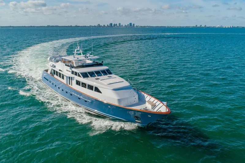 The Image of Luxurious 1998 Burger Raised Pilothouse yacht cruising on open water. - 0