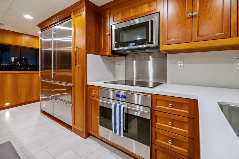 Slide: The Image of Luxurious yacht kitchen with stainless steel appliances and wooden cabinetry, 1998 Burger Raised Pilothouse. - 10