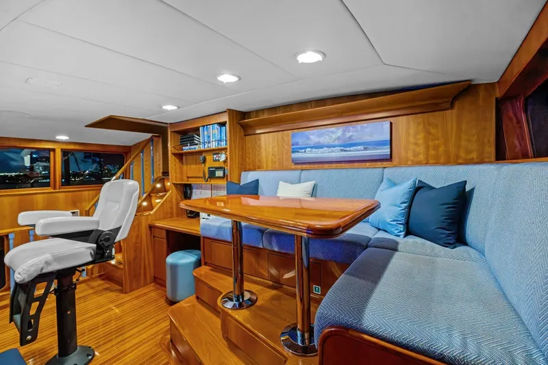 Slide: The Image of Luxurious interior of a 1998 Burger Raised Pilothouse yacht with elegant wood finishes. - 13