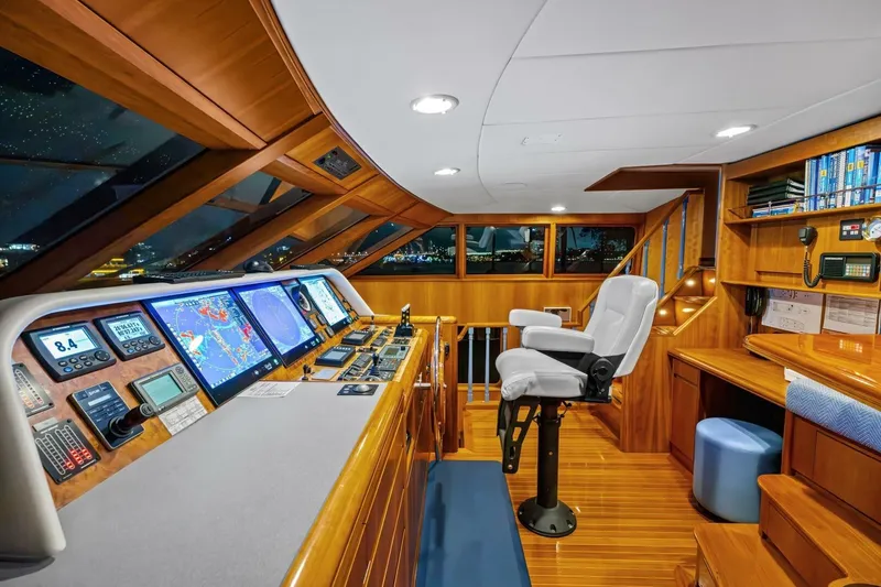 Slide: The Image of Luxurious 1998 Burger Raised Pilothouse yacht interior with navigation equipment and captain's chair. - 14