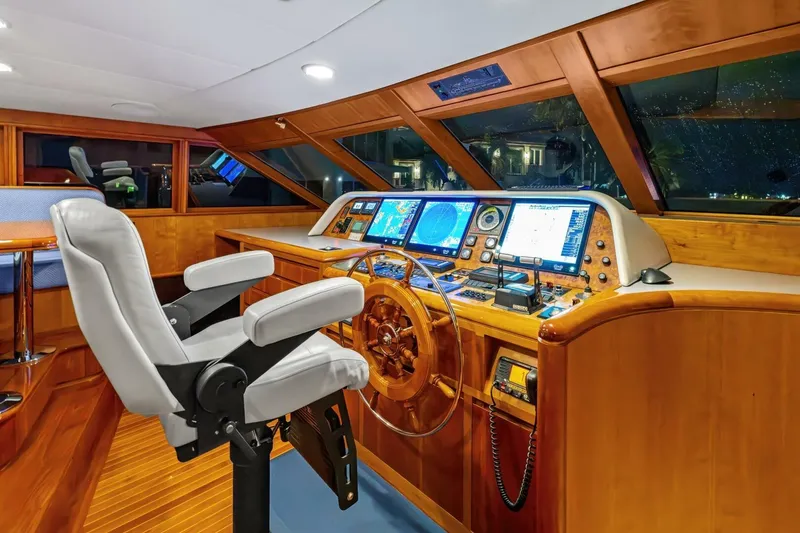 Slide: The Image of Luxurious 1998 Burger Raised Pilothouse yacht interior with navigation equipment and captain's chair. - 15