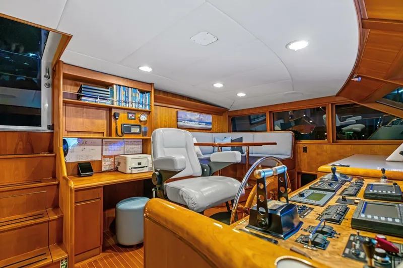 Slide: The Image of Luxurious 1998 Burger Raised Pilothouse yacht interior with navigation controls and seating. - 17