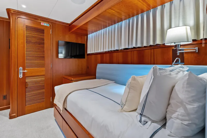 Slide: The Image of Luxurious cabin interior of 1998 Burger Raised Pilothouse yacht with elegant wood finishes. - 28