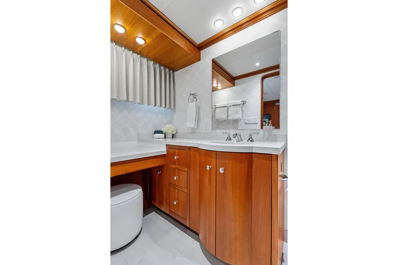 Slide: The Image of Luxurious bathroom in 1998 Burger Raised Pilothouse yacht with wooden cabinetry and modern fixtures. - 29