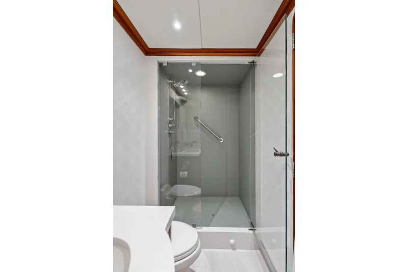 Slide: The Image of Luxurious bathroom with glass shower in 1998 Burger Raised Pilothouse yacht. - 30