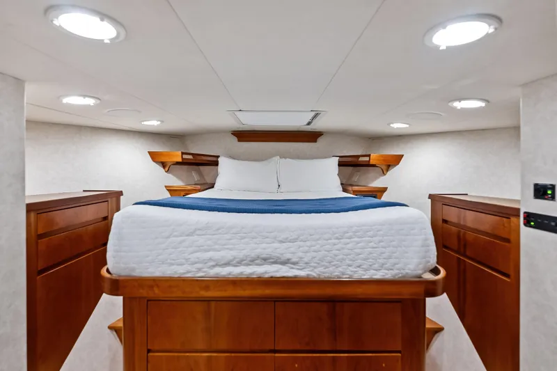 Slide: The Image of Luxurious cabin interior of 1998 Burger Raised Pilothouse yacht with cozy bed and wooden furnishings. - 31