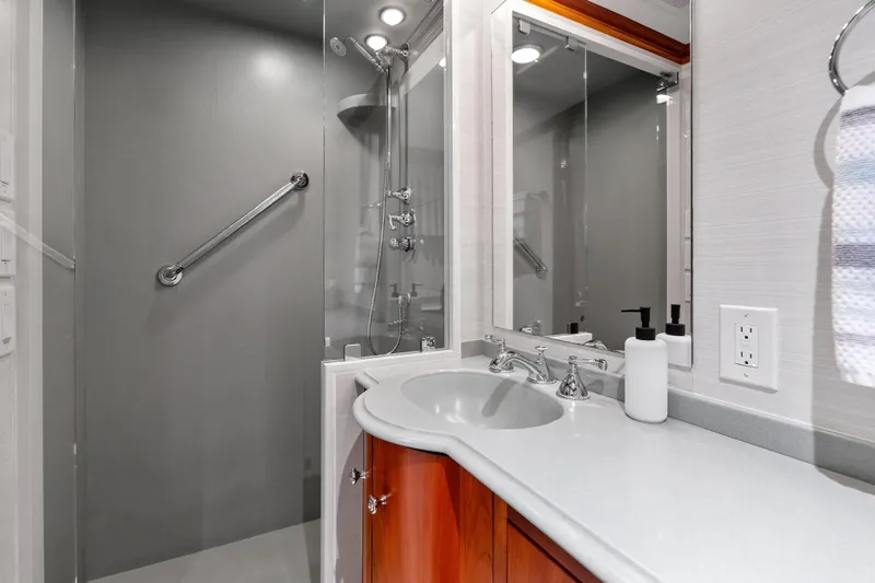 Slide: The Image of Luxurious bathroom in 1998 Burger Raised Pilothouse yacht with modern fixtures and sleek design. - 32