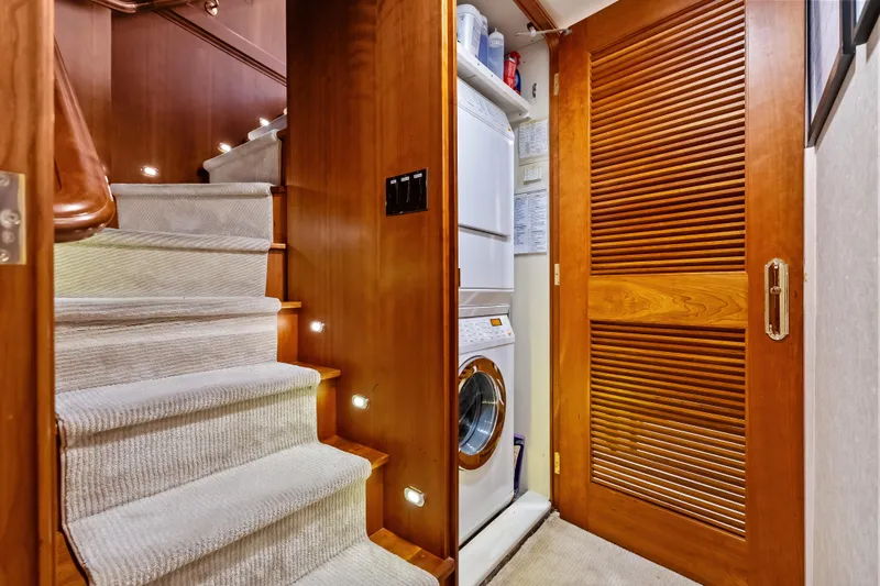 Slide: The Image of Staircase and laundry area inside a 1998 Burger Raised Pilothouse yacht. - 33