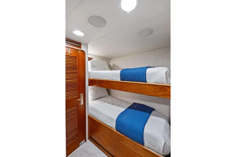 Slide: The Image of Bunk beds with blue accents in 1998 Burger Raised Pilothouse yacht cabin. - 36