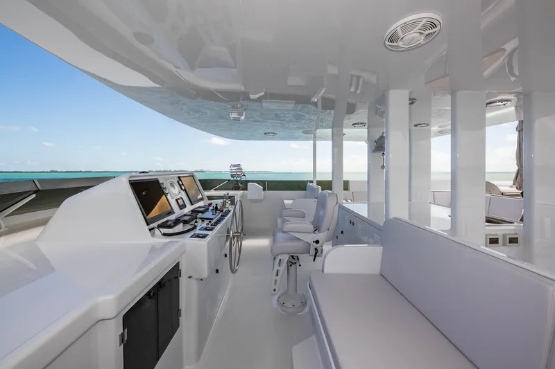 Slide: The Image of Luxurious 1998 Burger Raised Pilothouse yacht interior with modern navigation equipment and ocean view. - 41