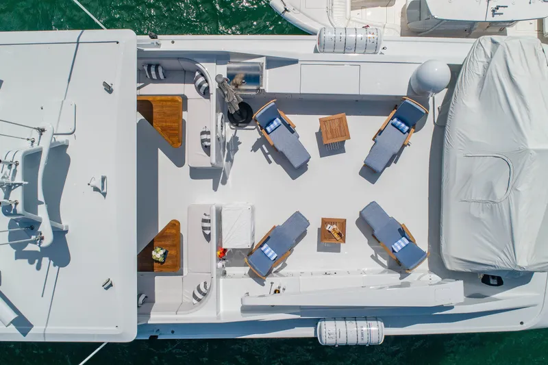 Slide: The Image of Aerial view of 1998 Burger Raised Pilothouse yacht deck with lounge chairs and tables. - 49