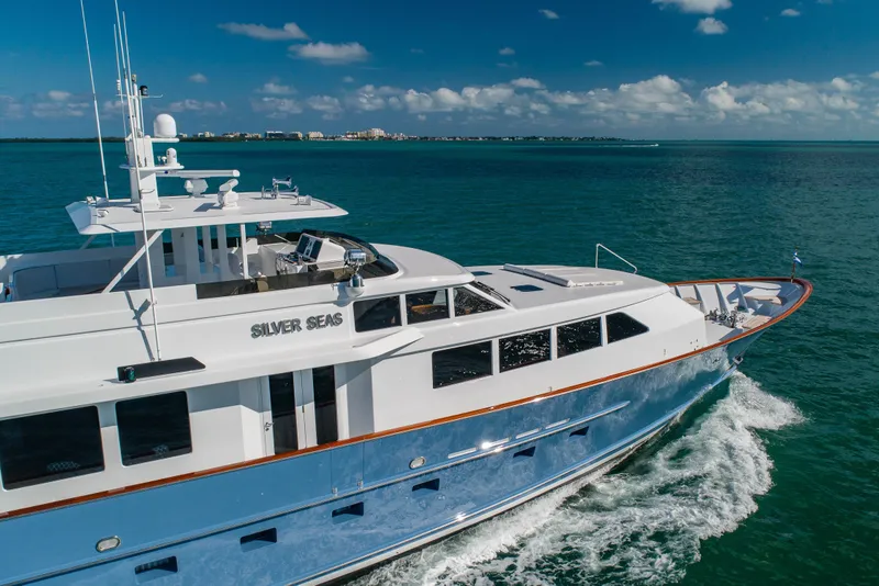 Slide: The Image of Luxurious 1998 Burger Raised Pilothouse yacht cruising on clear blue waters. - 52