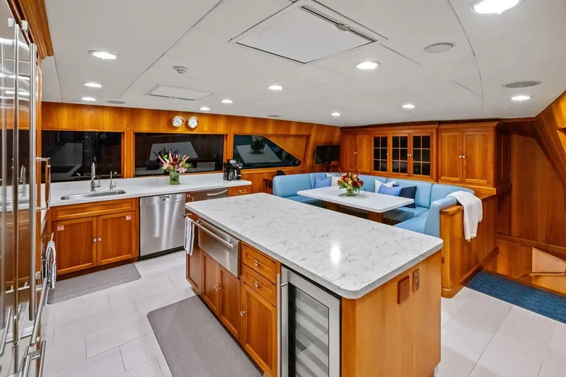 Slide: The Image of Luxurious kitchen and dining area in a 1998 Burger Raised Pilothouse yacht. - 8