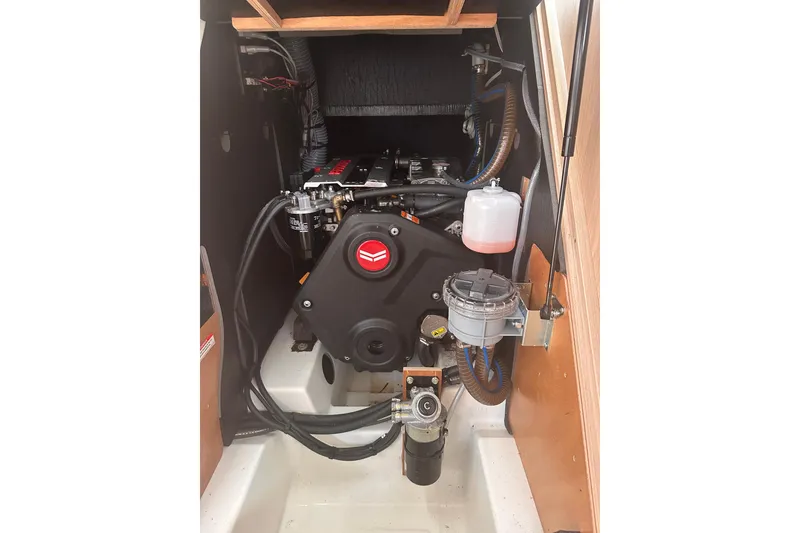 Slide: The Image of Engine compartment of 2025 Beneteau Oceanis 46.1 sailboat, showcasing mechanical components. - 14