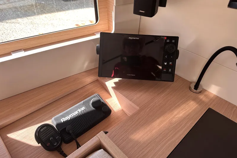 Slide: The Image of Interior of 2025 Beneteau Oceanis 46.1 featuring Raymarine navigation equipment. - 17