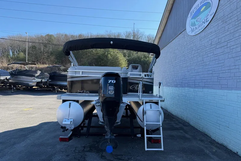 Slide: The Image of 2021 Avalon VTX Cruise 18' pontoon boat with outboard motor, parked at marina. - 3