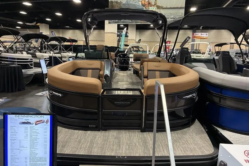 The Image of 2026 Bennington 23 MSL pontoon boat displayed at an indoor boat show. - 1
