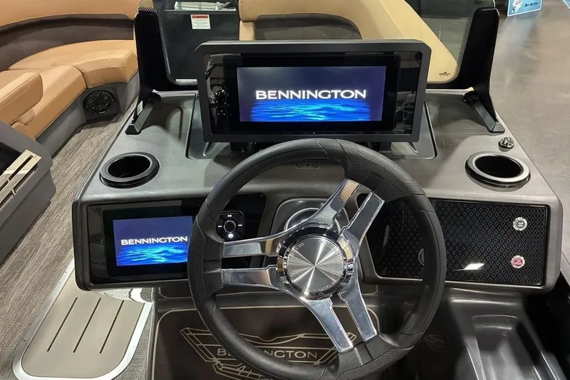 Slide: The Image of 2026 Bennington 23 MSL boat dashboard with steering wheel and digital displays. - 11