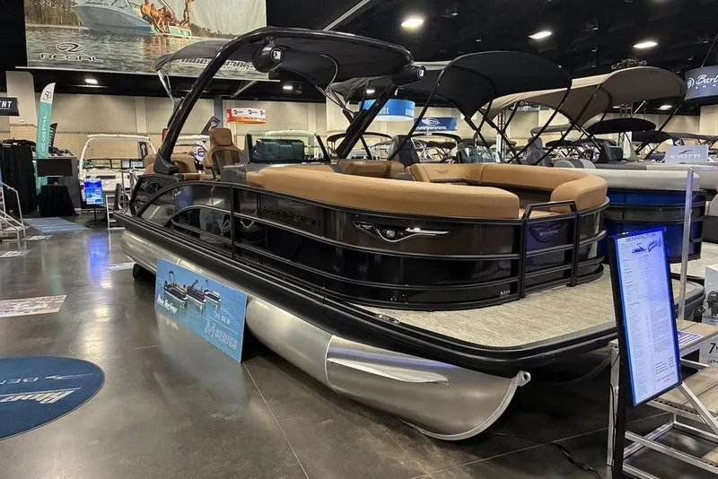 Slide: The Image of 2026 Bennington 23 MSL pontoon boat displayed at a boat show. - 4