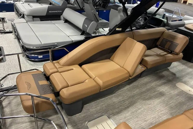 Slide: The Image of 2026 Bennington 23 MSL boat interior with luxurious tan seating and modern design. - 6
