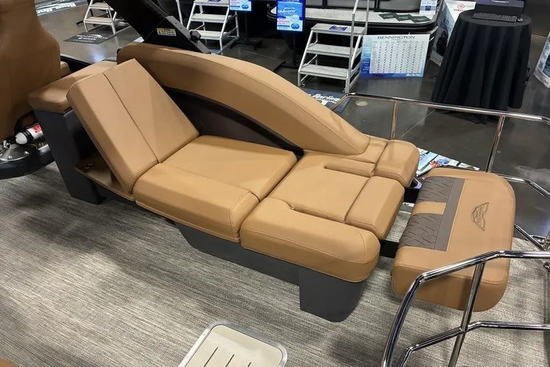 Slide: The Image of Luxurious seating on 2026 Bennington 23 MSL boat, featuring tan upholstery and ergonomic design. - 8