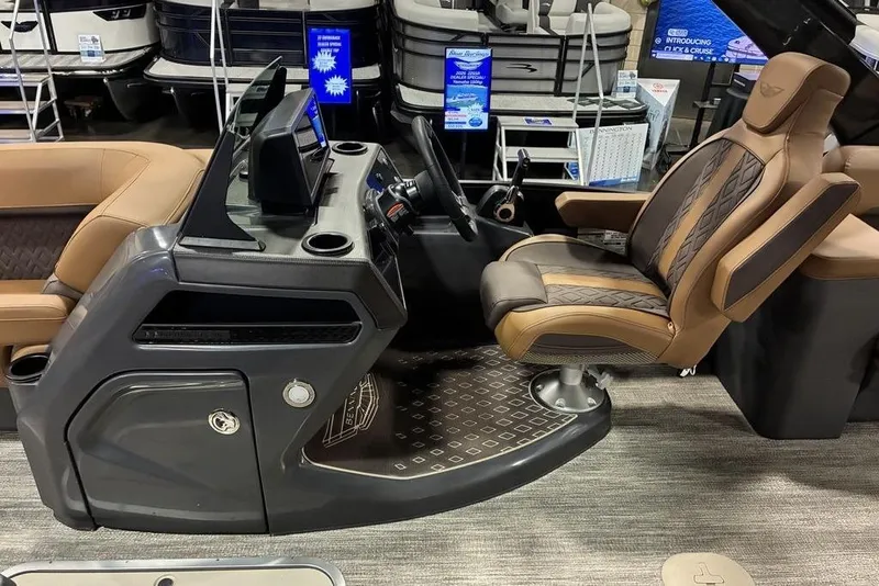 Slide: The Image of 2026 Bennington 23 MSL boat interior with luxurious captain's chair and modern dashboard. - 9