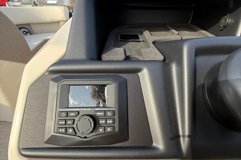 Slide: The Image of Dashboard of 2026 Alera M23L boat featuring a Roswell audio control panel. - 13