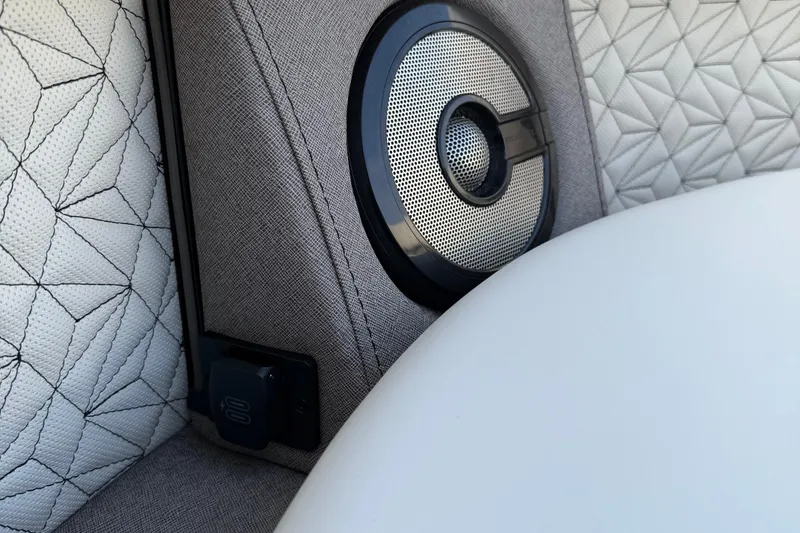 Slide: The Image of Interior of 2026 Alera M23L featuring speaker and geometric upholstery design. - 16