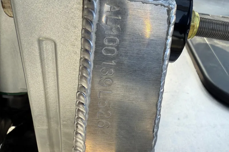 Slide: The Image of Close-up of Alera M23L 2026 metal component with visible serial number and weld. - 20